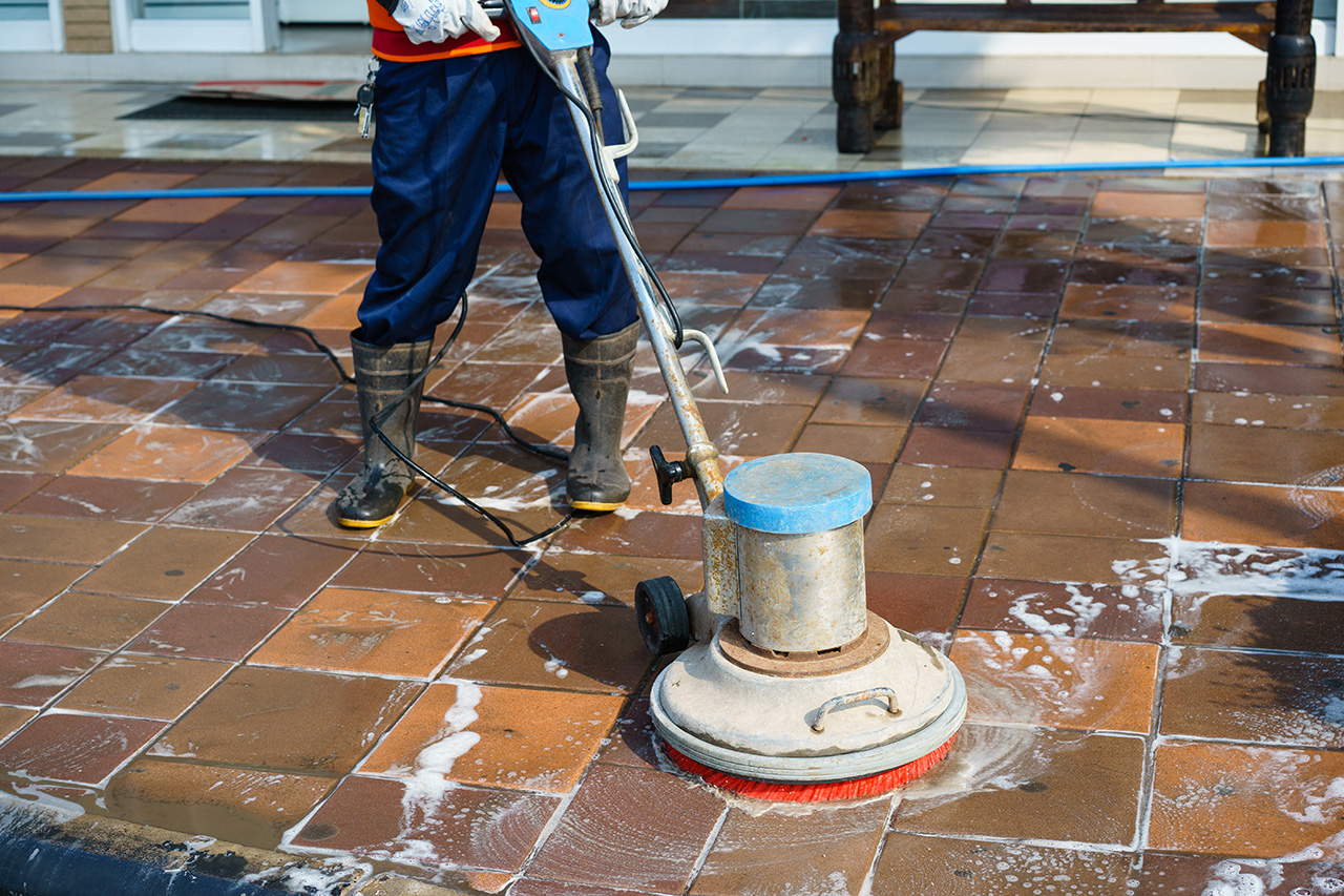 Worker Cleaning Bathroom Floor